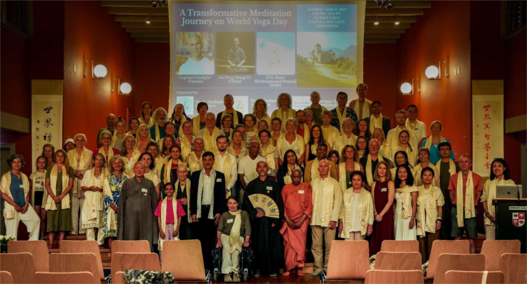 A large group gathers for a photograph after a World Meditation Day event.